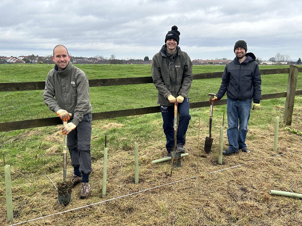 3 men with spades showing a digging motion