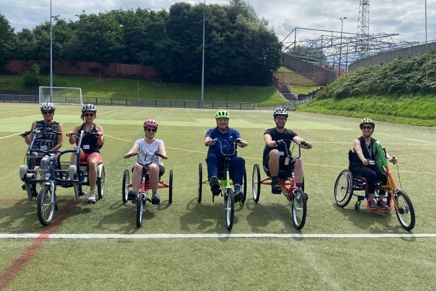 People using adapted cycles