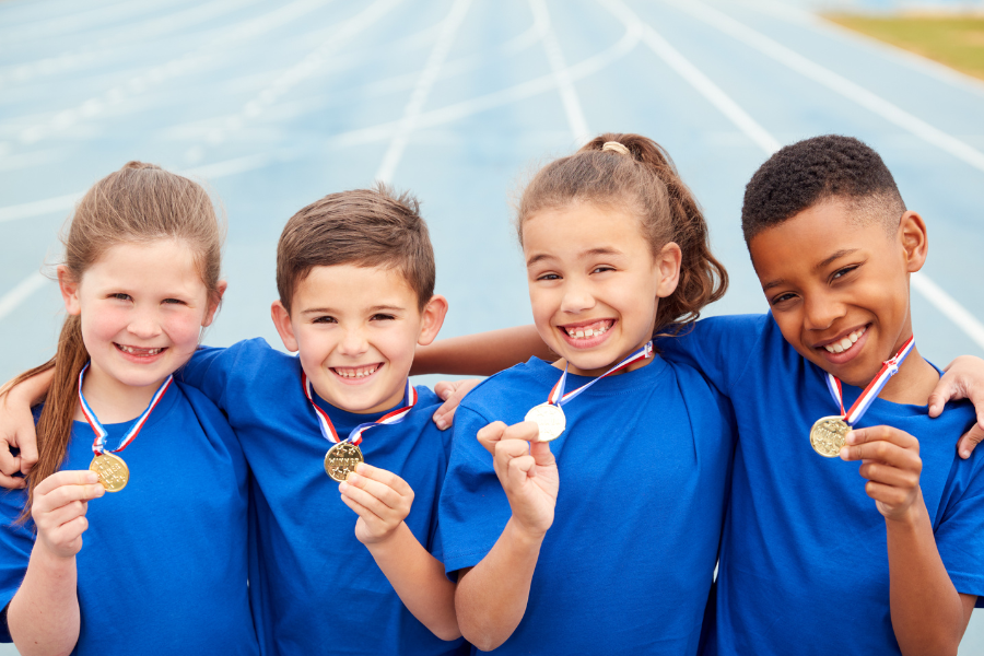 Children with medals after sports