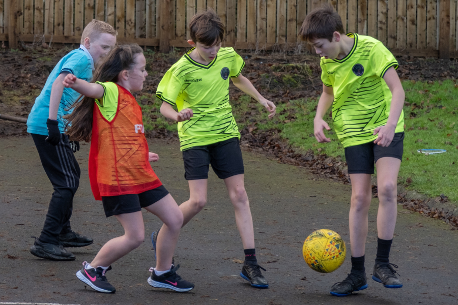 children playing football