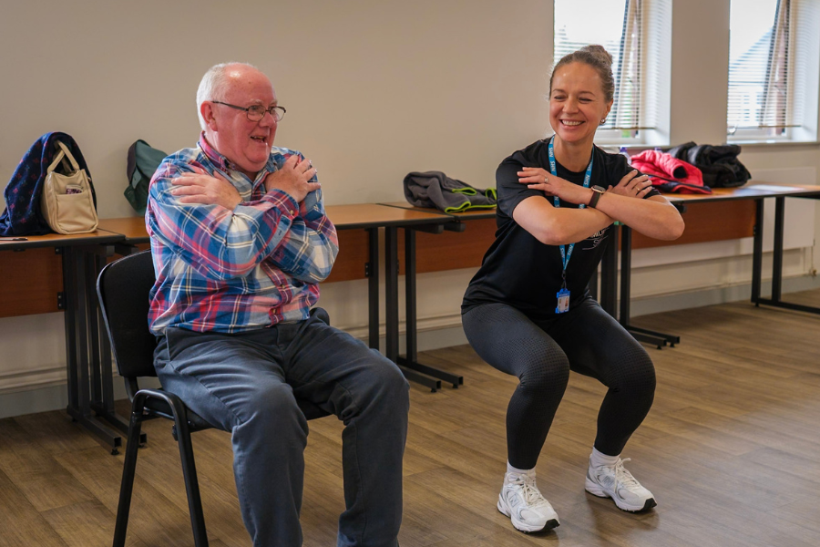 Jurgita working with a patient on physical activity exercises